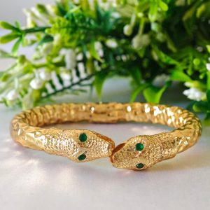 Bracciale rigido serpente in ottone dorato con zirconi